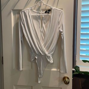 White Lulu’s v-neck body suit, size small